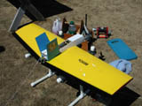 Rene's plane after the same mid-air (lucky stiff!).  Note the two slices in his right wing from my prop.